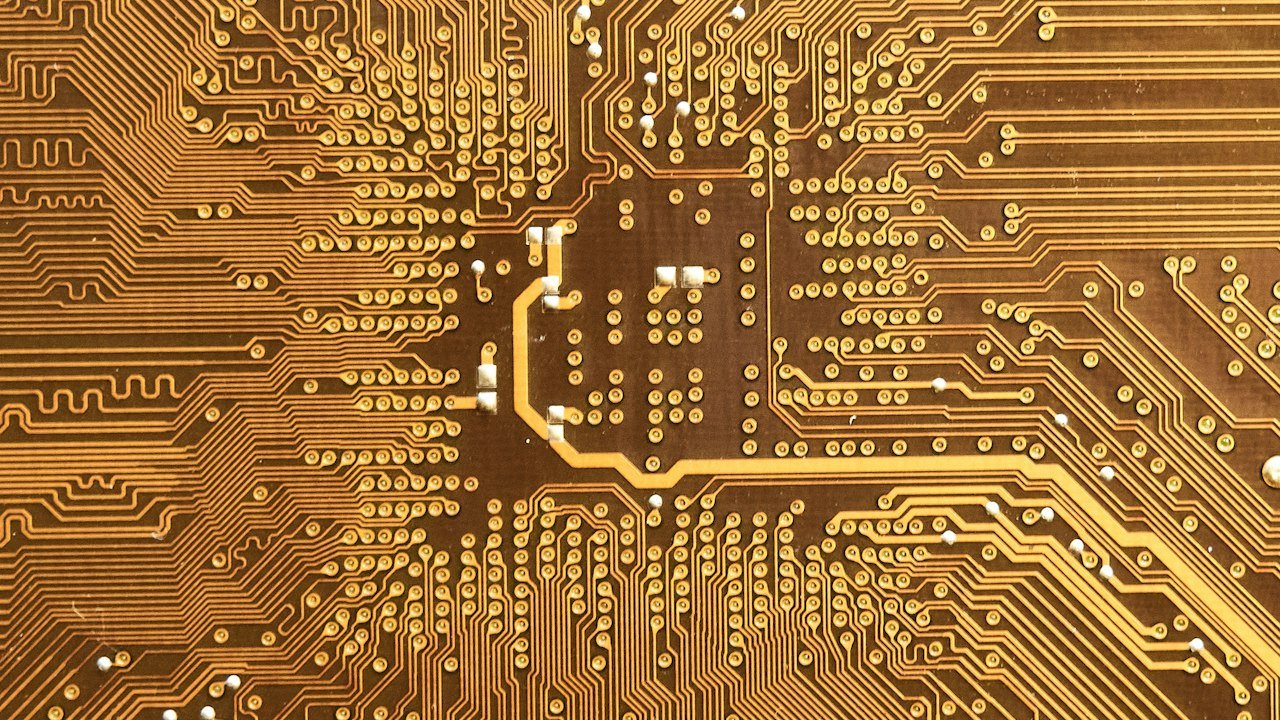 Close-up of a computer chip circuit board illustrating Nvidia AI stock outlook chip demand