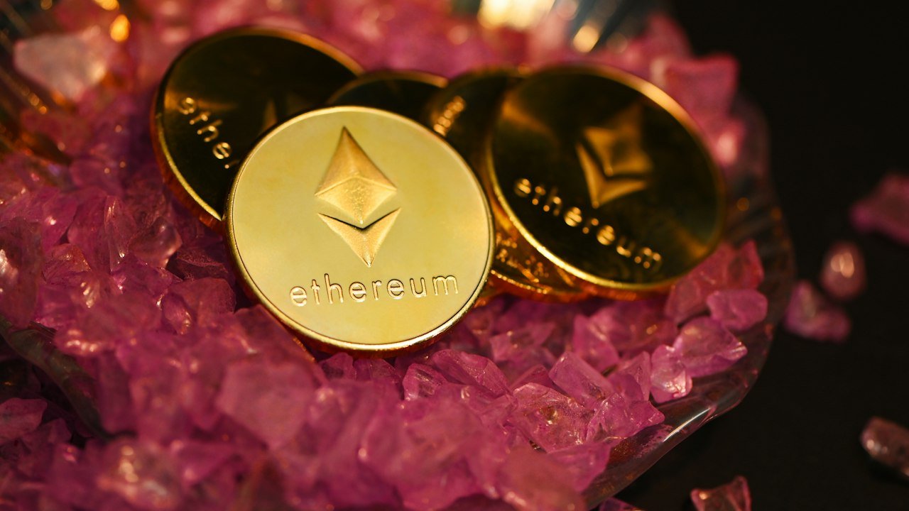 Gold coins on crystals, a picture for Ethereum futures ETFs versus spot funds
