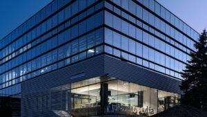 Modern glass office building representing the Microsoft stock forecast