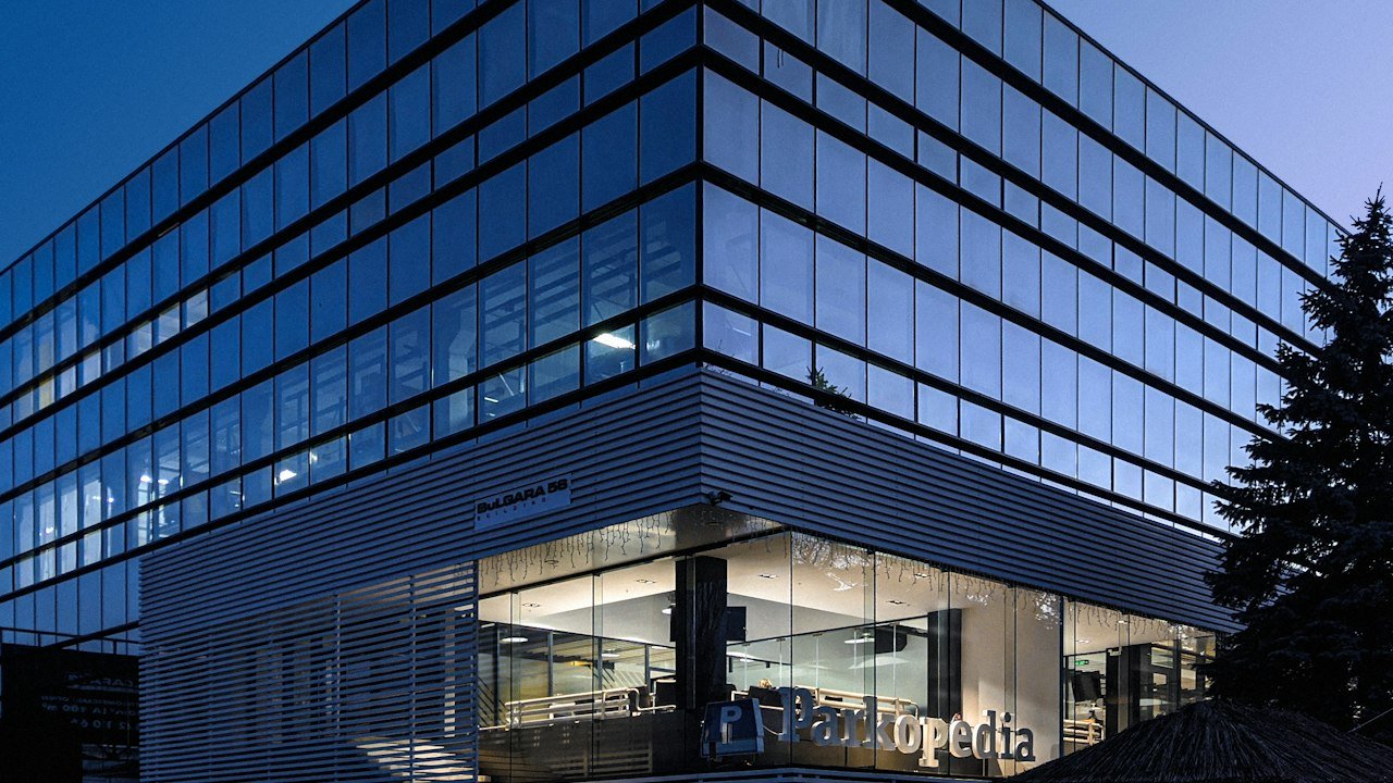 Modern glass office building representing the Microsoft stock forecast