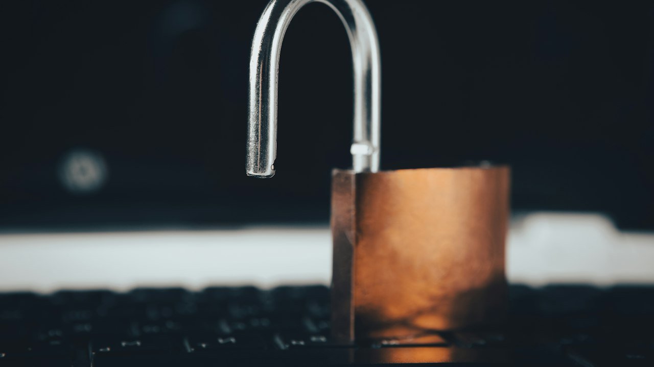 Padlock on top of a laptop showing the data privacy focus of a Zcash ETF