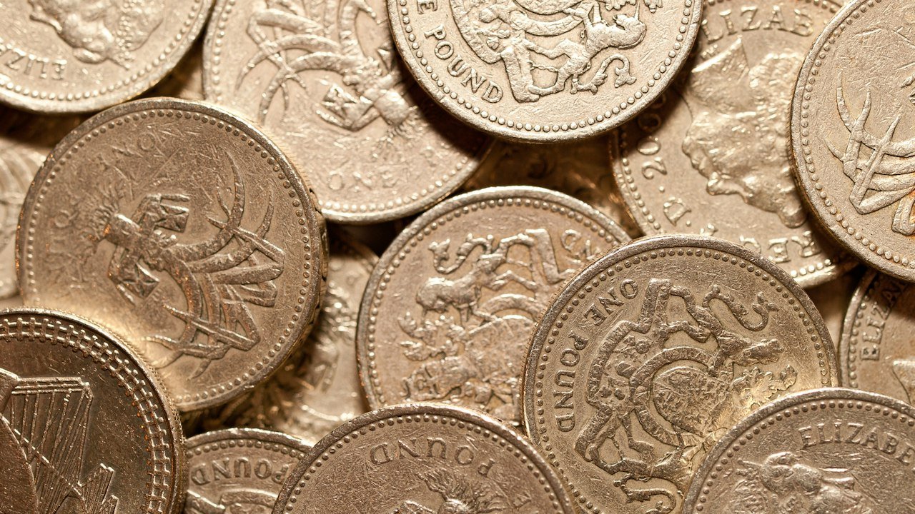 Pile of British coins representing savings and borrowing costs after the Bank of England interest rate decision