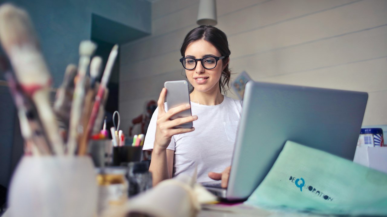 Woman using a smartphone to try how to use ChatGPT on mobile